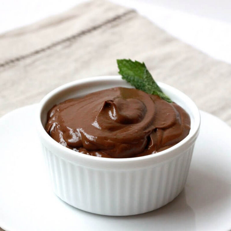 A white bowl filled with avocado chocolate mousse