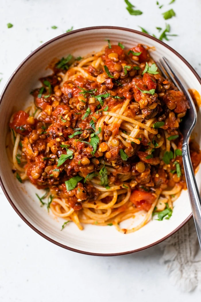 A bowl of lentil bolognese and spaghetti