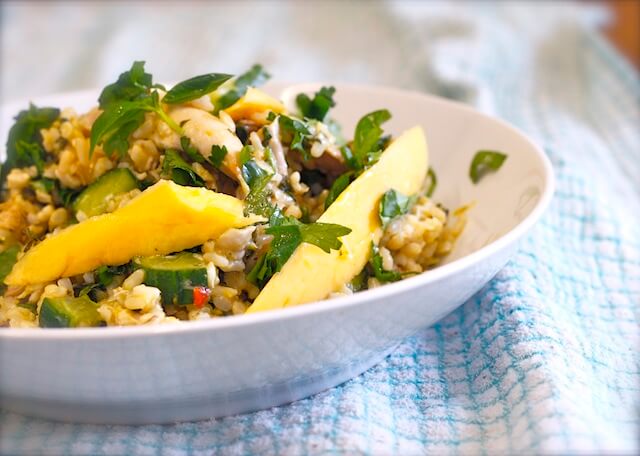 A bowl of quinoa with mackerel and mango