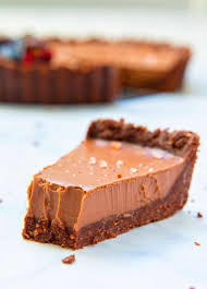 A slice of chocoate tart with a bite taken from it