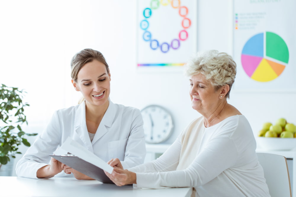 A woman receiving female advice from a women's health specialist